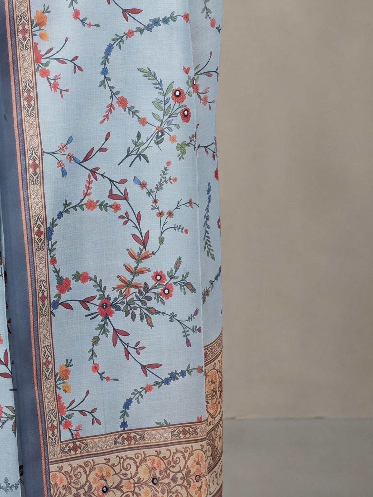 Pallu detail of light blue linen blend saree showing botanical floral and leaf design and printed border
