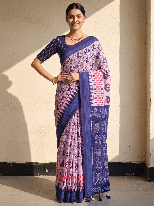 Woman wearing blue cotton saree with ikat resist-dyed pattern and blue blouse