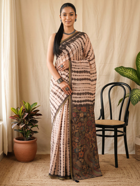 Woman wearing peach cotton blend saree with tie-and-dye resist pattern and peach blouse
