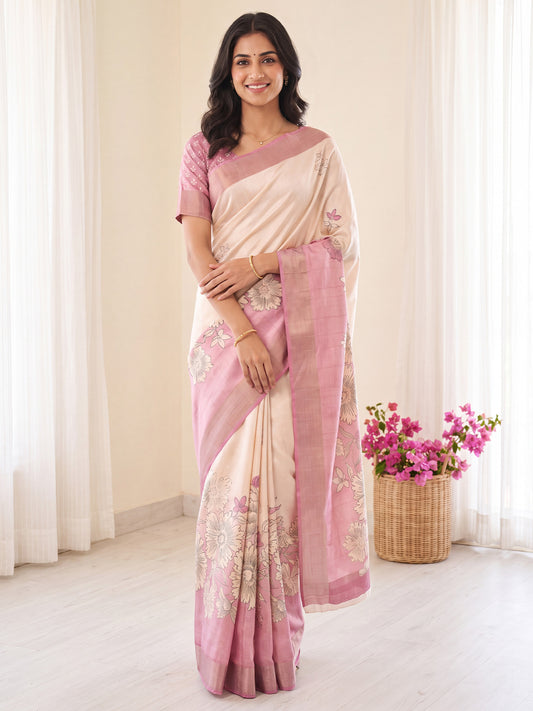 Woman wearing white satin silk saree with traditional indian motif work and pink blouse