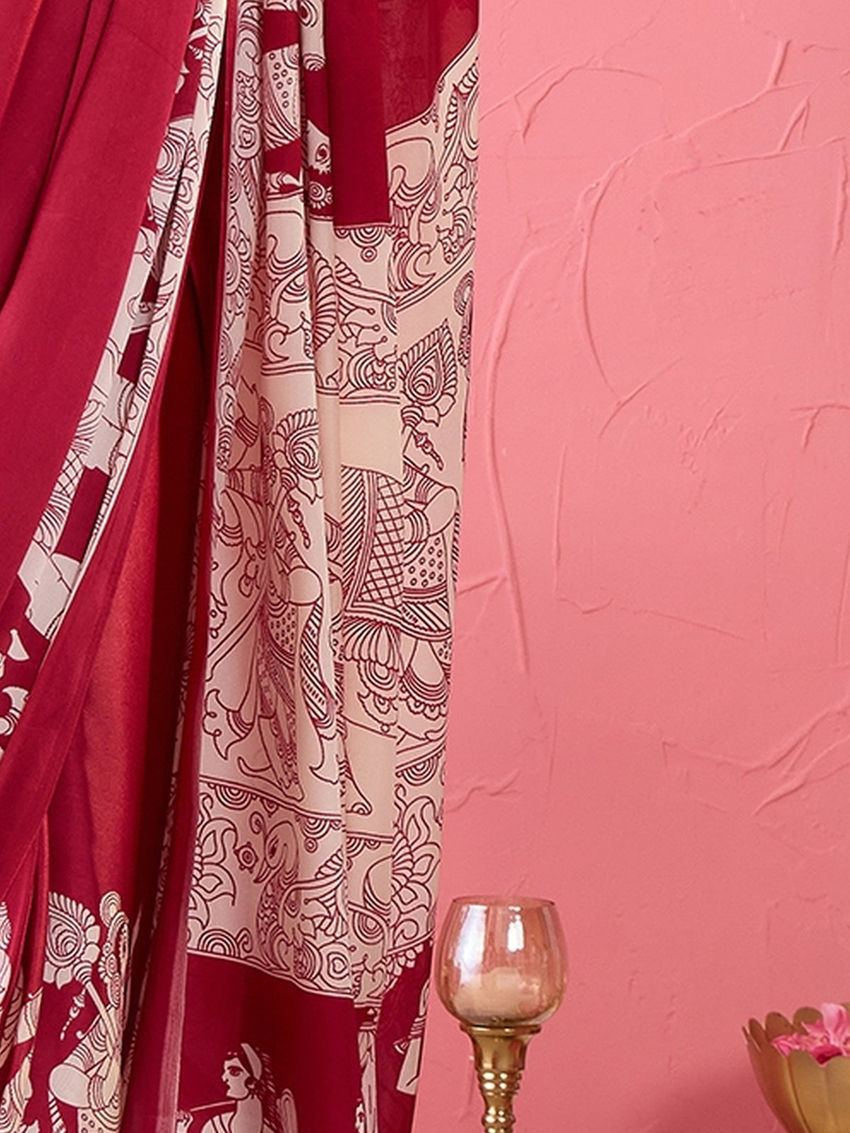 Pallu detail of burgundy satin saree showing kalamkari narrative motif work and printed border