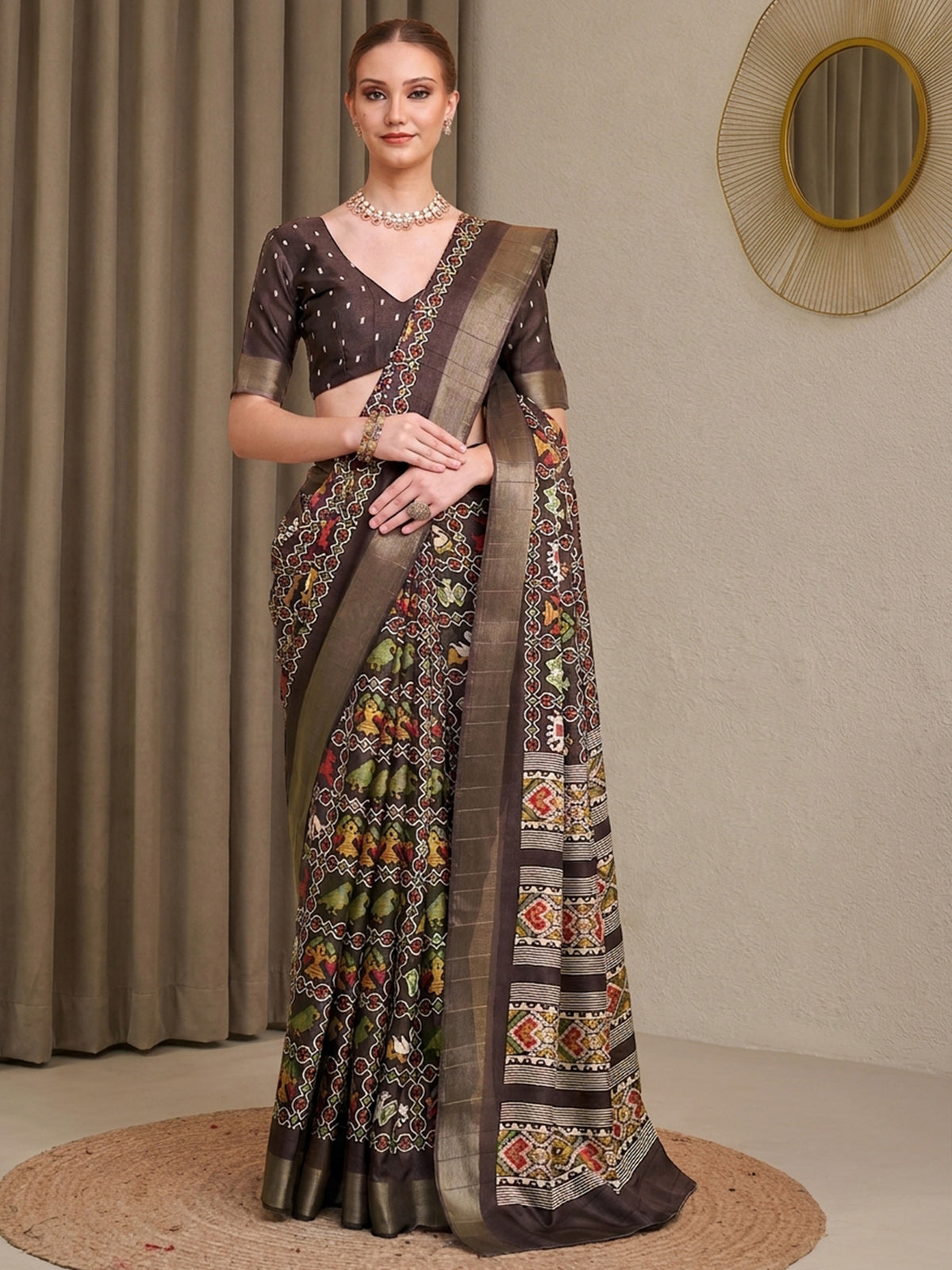 Woman wearing coffee brown silk blend saree with traditional indian motif work and coffee brown blouse