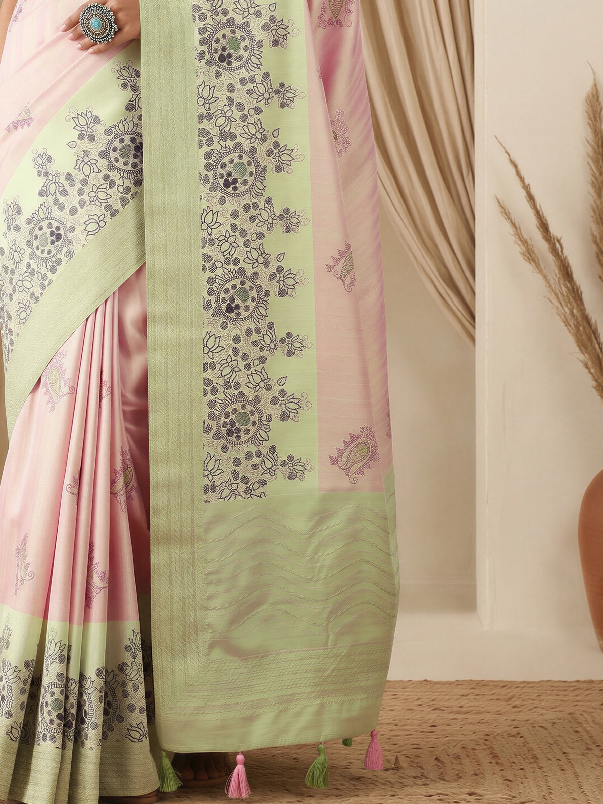 Pallu detail of pink silk blend saree showing madhubani folk-art motifs and embroidered border