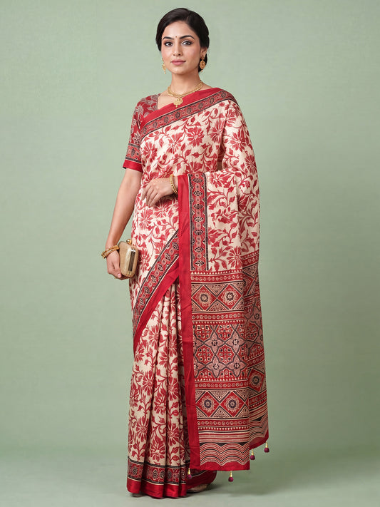 Woman wearing cream satin saree with ajrak block-print motif work and red blouse