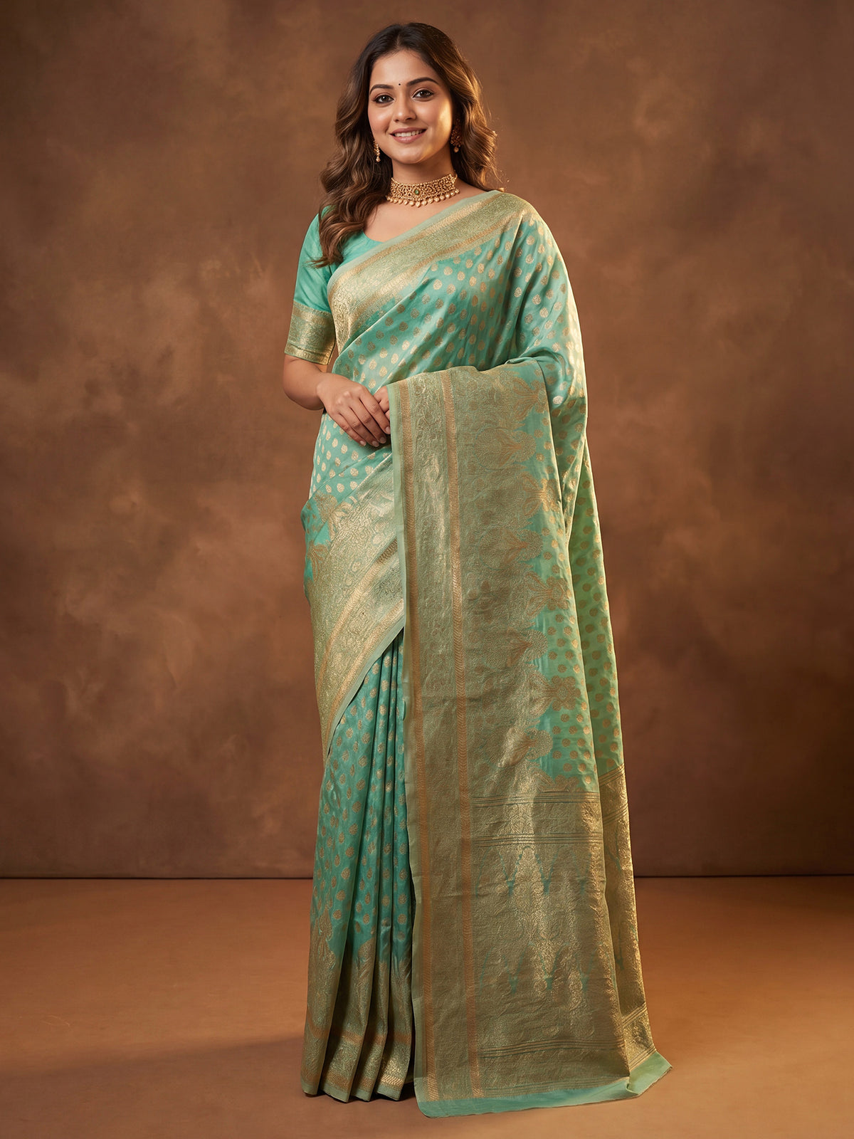 Woman wearing light blue silk blend saree with zari butta (metallic motif) work and light blue blouse