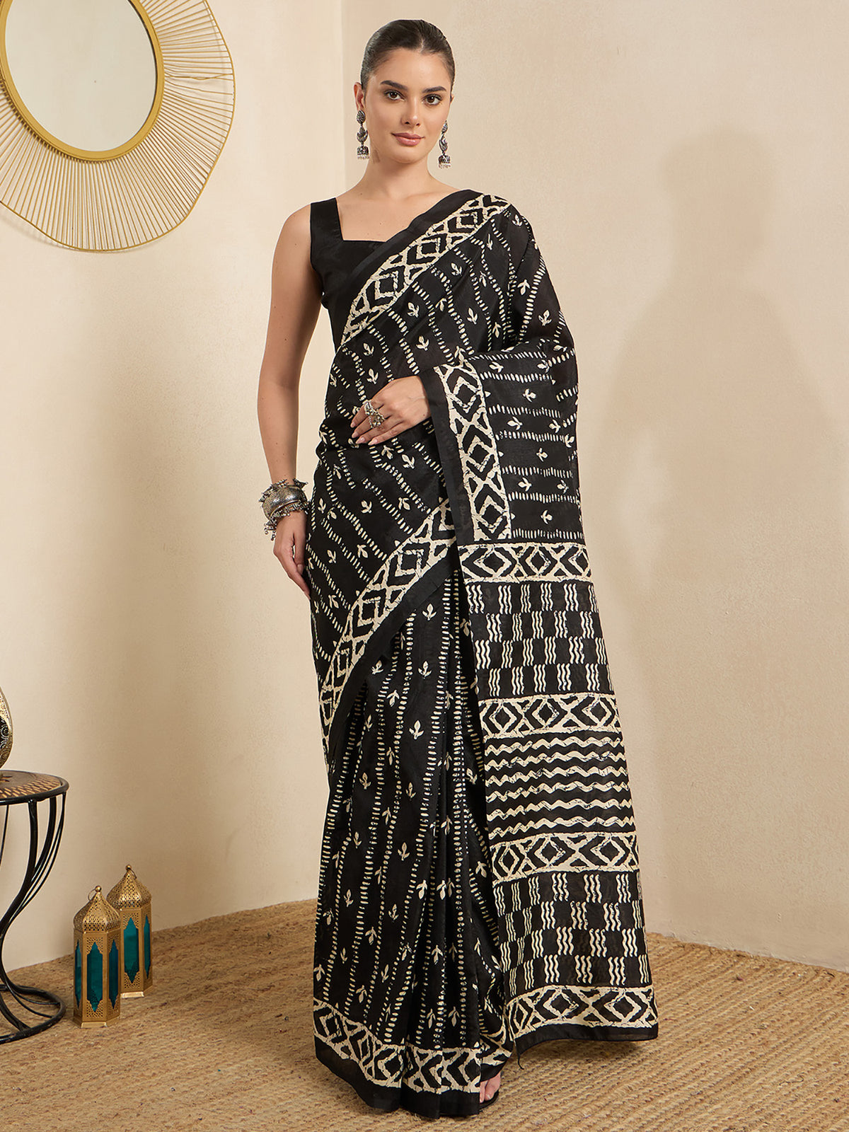 Woman wearing black bhagalpuri silk saree with batik wax-resist design and black blouse