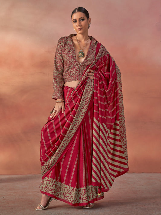 Woman wearing maroon silk blend saree with traditional indian motif work and maroon blouse
