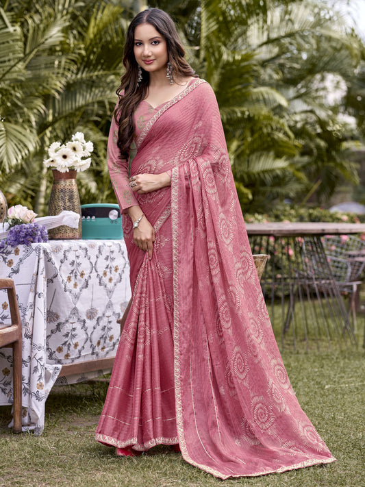 Woman wearing peach chiffon saree with traditional indian motif work and peach blouse