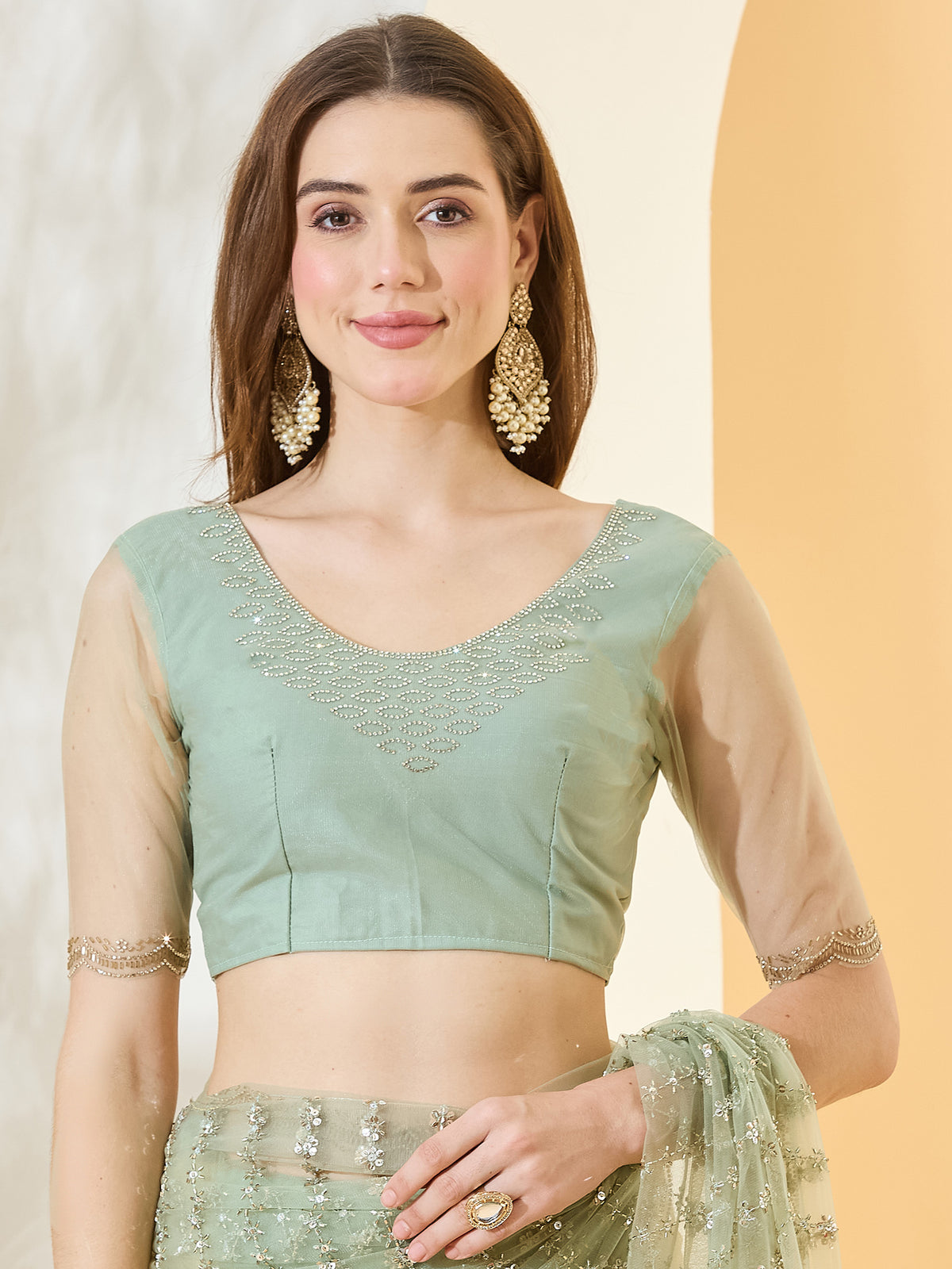 Unstitched light green net blouse piece with embellished design