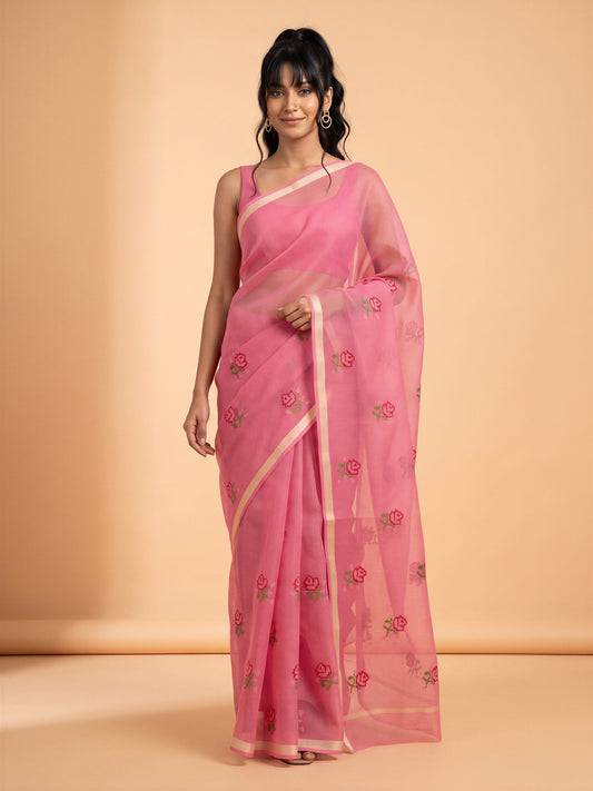 Woman wearing pink kota doria cotton saree with embroidered motif work and pink blouse