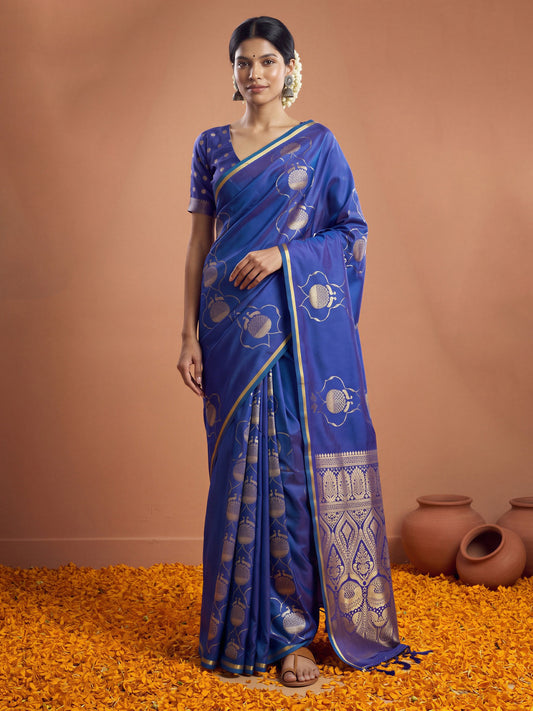 Woman wearing blue satin saree with zari butta (metallic motif) work and blue blouse