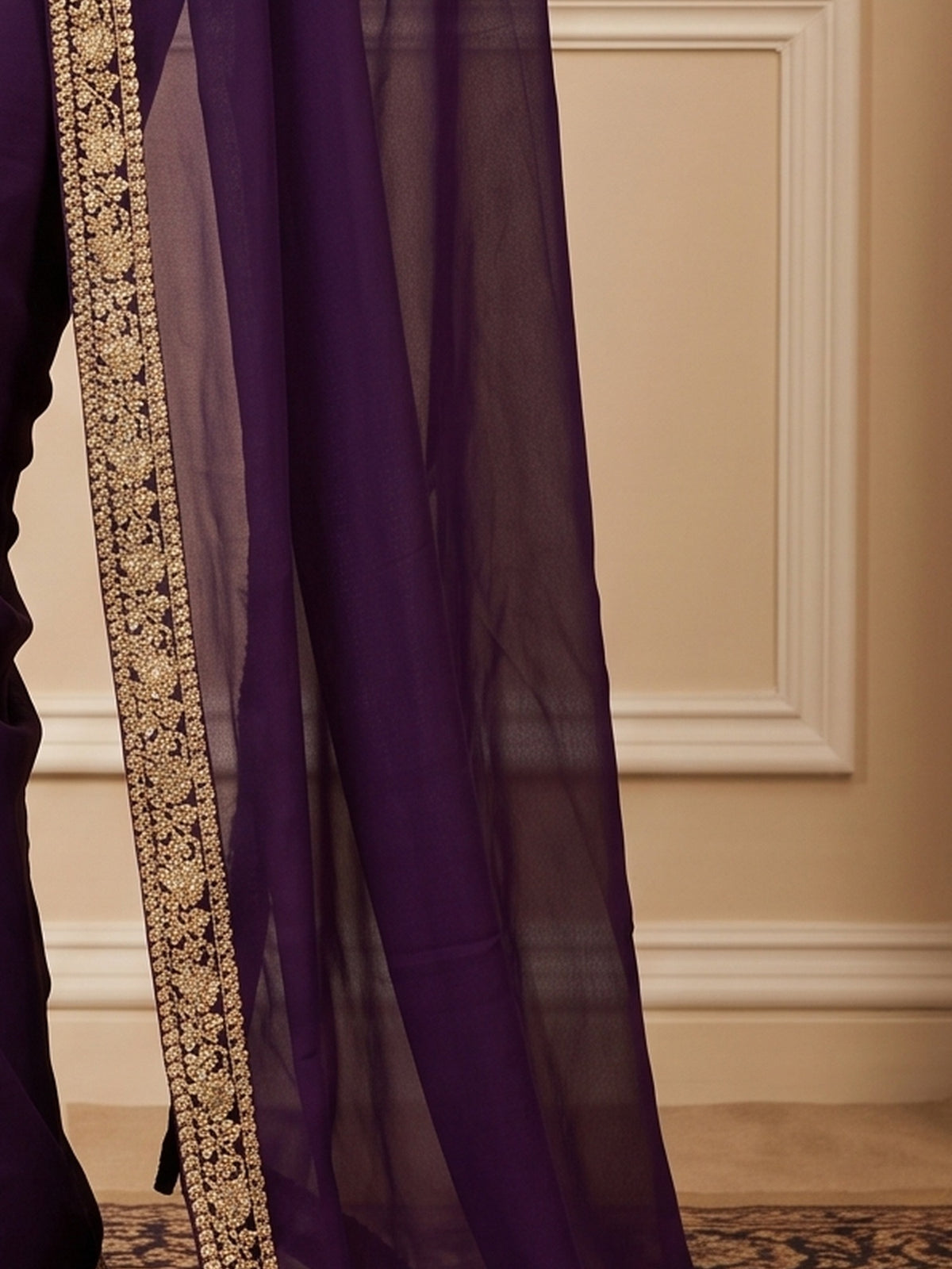 Pallu detail of purple satin silk saree showing clean solid-tone finish and embellished border