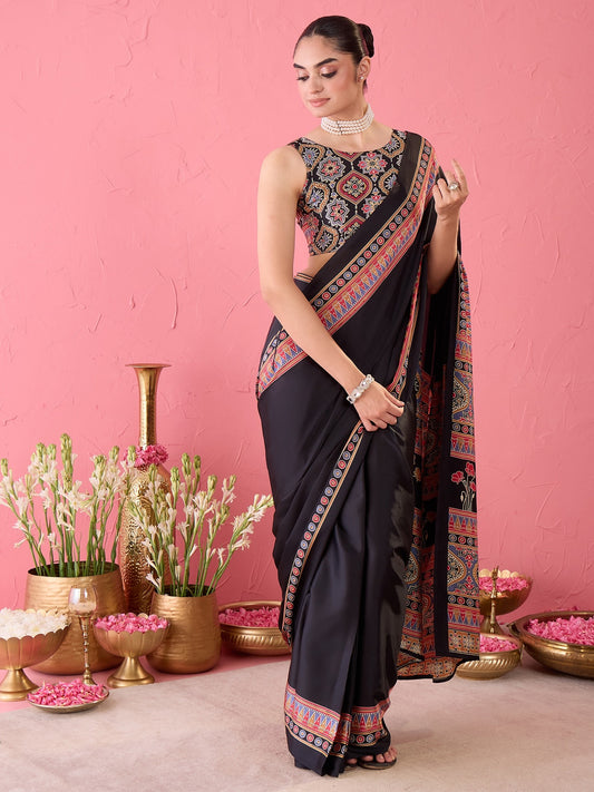 Woman wearing black satin ready to wear saree with ajrak block-print motif work and black blouse