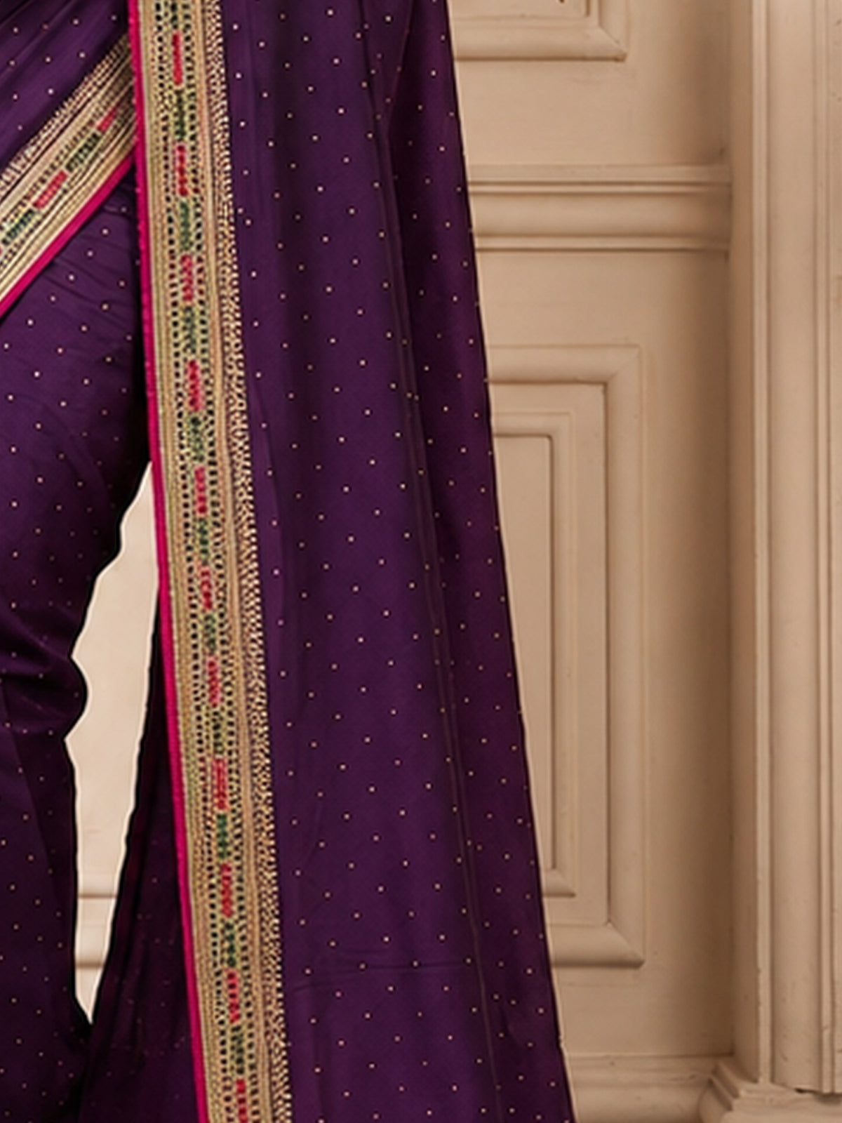 Pallu detail of wine vichitra silk saree showing ornamented surface design and embellished border