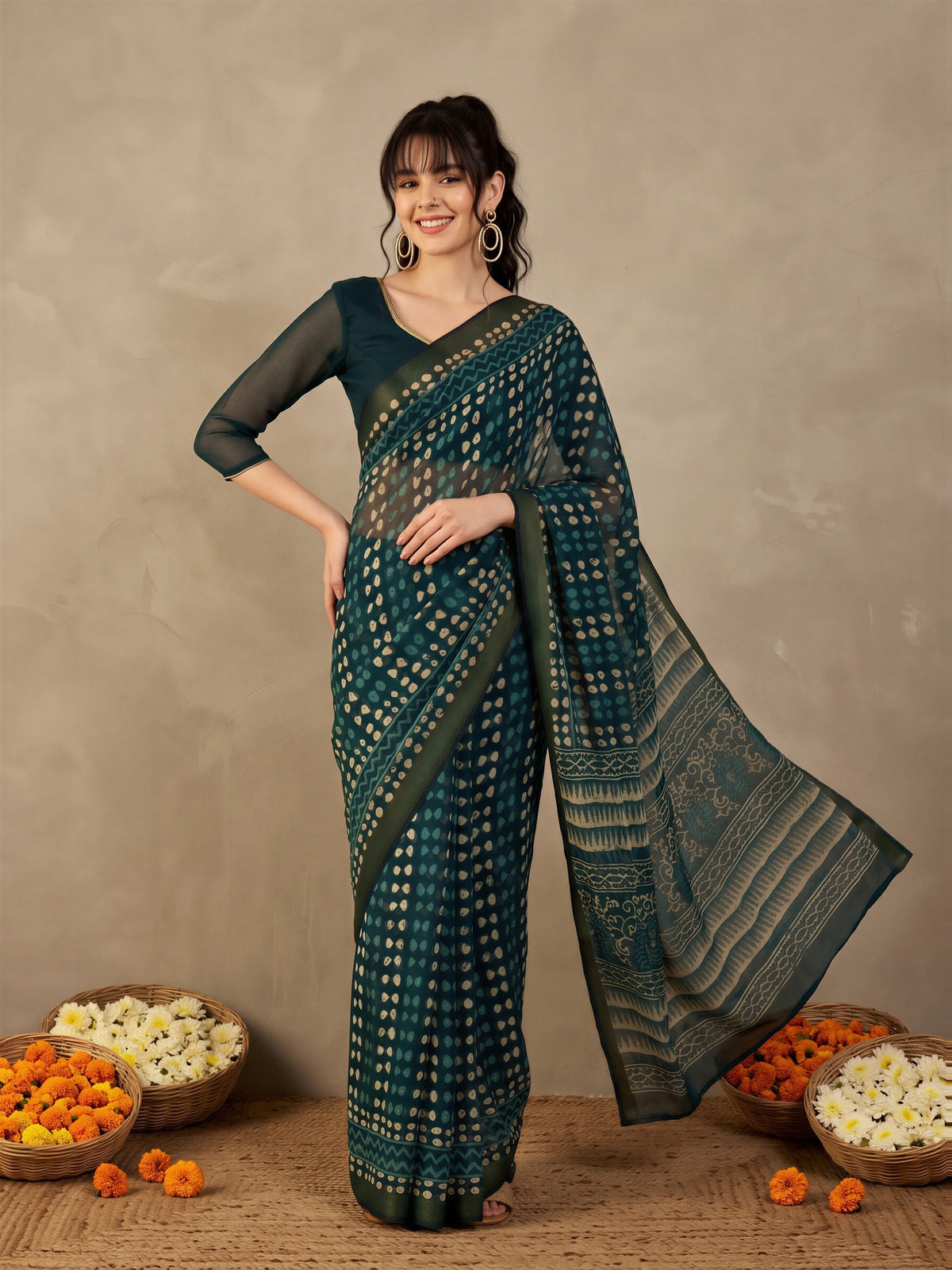 Woman wearing teal blue cotton linen saree with traditional indian motif work and teal blue blouse