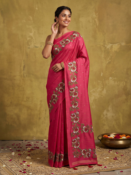 Woman wearing pink dola silk saree with zari butta (metallic motif) work and pink blouse