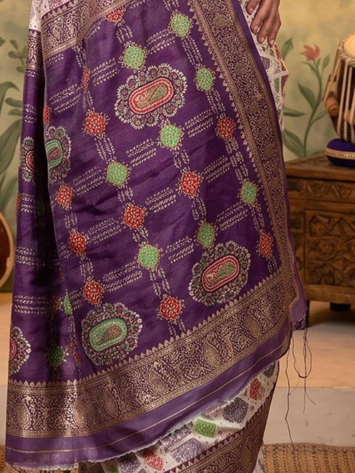 Pallu detail of purple silk blend saree showing traditional indian motif work and zari border