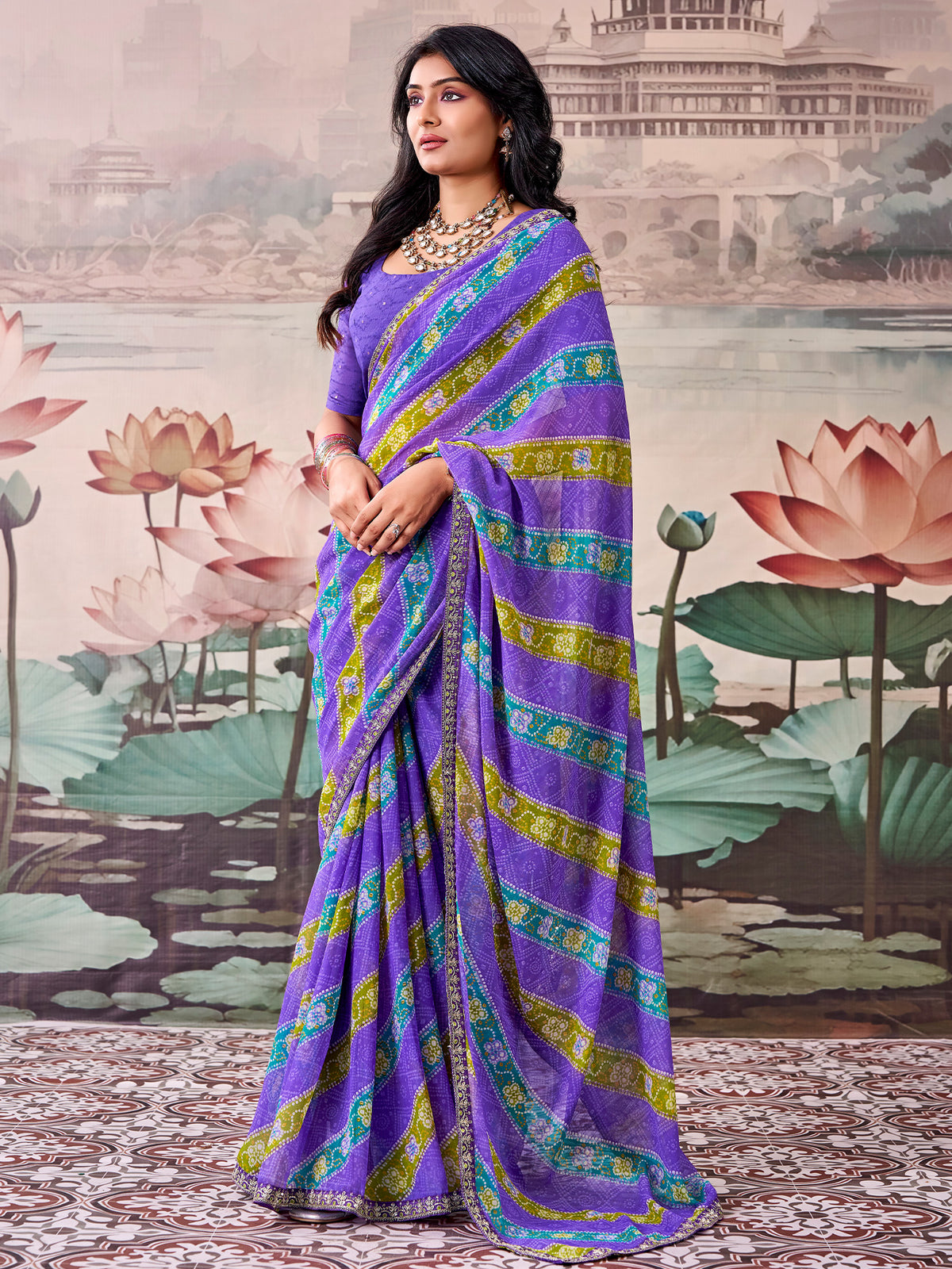 Woman wearing violet georgette saree with bandhani tie-dye dot work and violet blouse