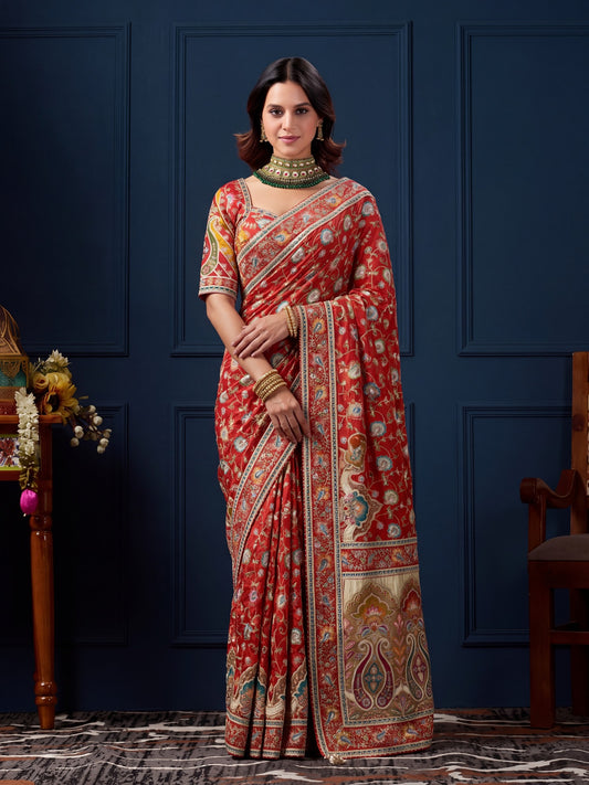 Woman wearing orange silk blend saree with traditional indian motif work and orange blouse