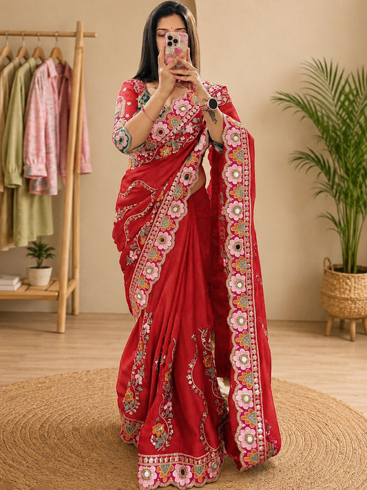 Woman wearing red pure georgette saree with all-over floral design and red blouse