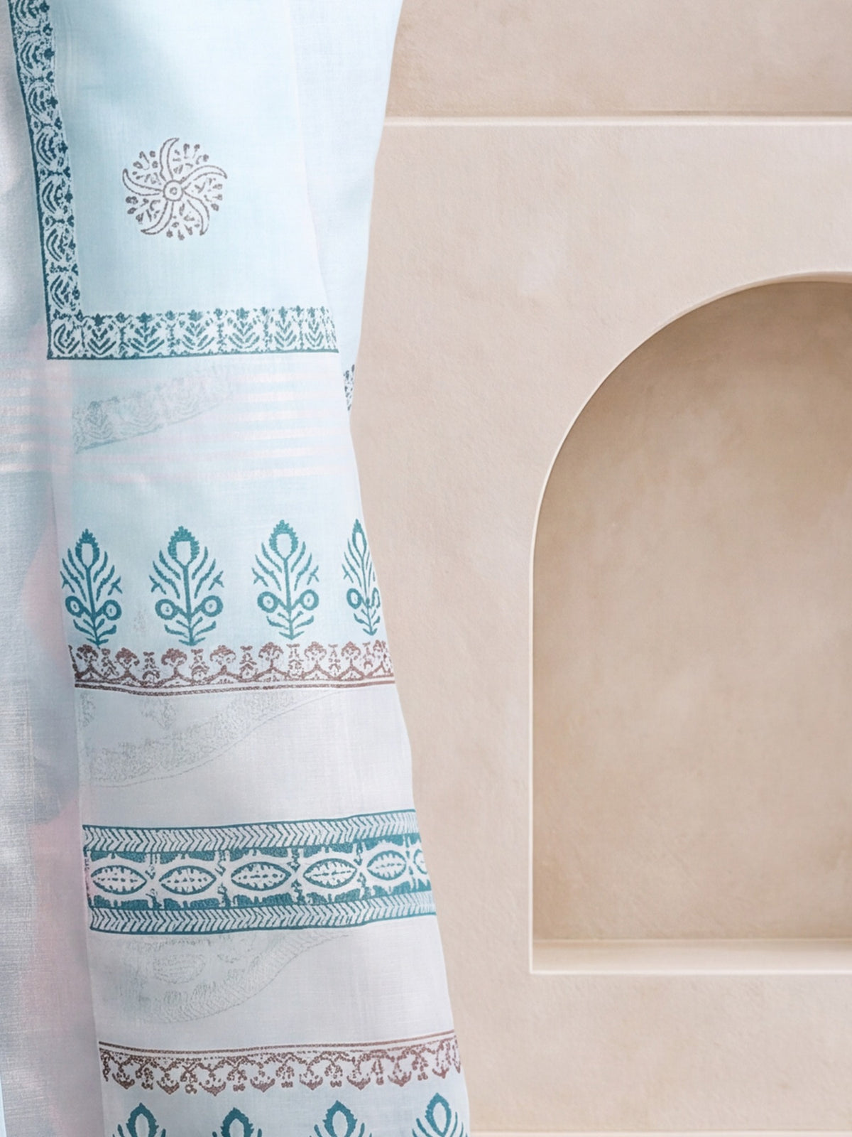 Pallu detail of light blue linen saree showing bagh block-print motif work and printed border