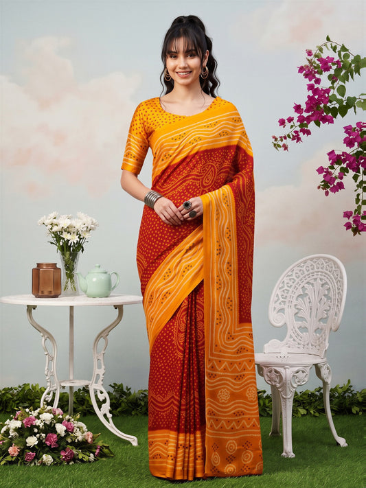 Woman wearing red satin silk saree with bandhani tie-dye dot work and orange blouse