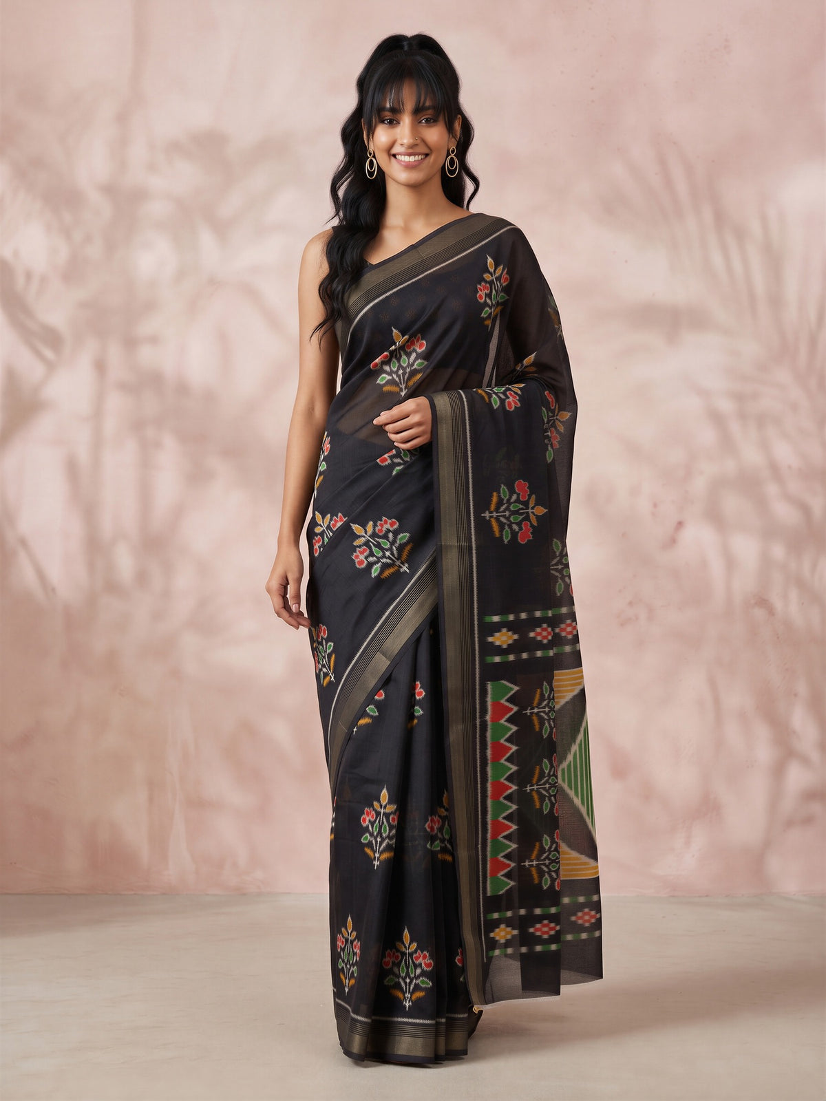 Woman wearing black cotton linen saree with traditional indian motif work and black blouse