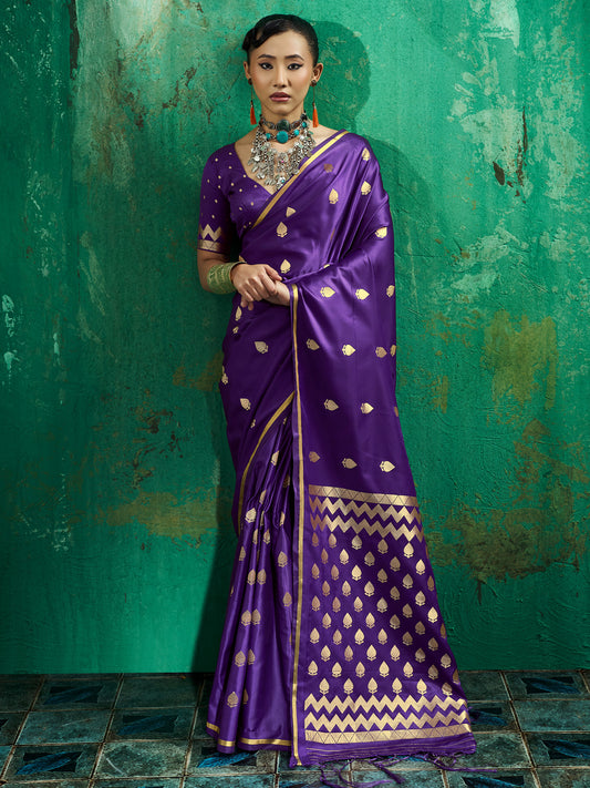 Woman wearing purple satin silk saree with zari butta (metallic motif) work and purple blouse