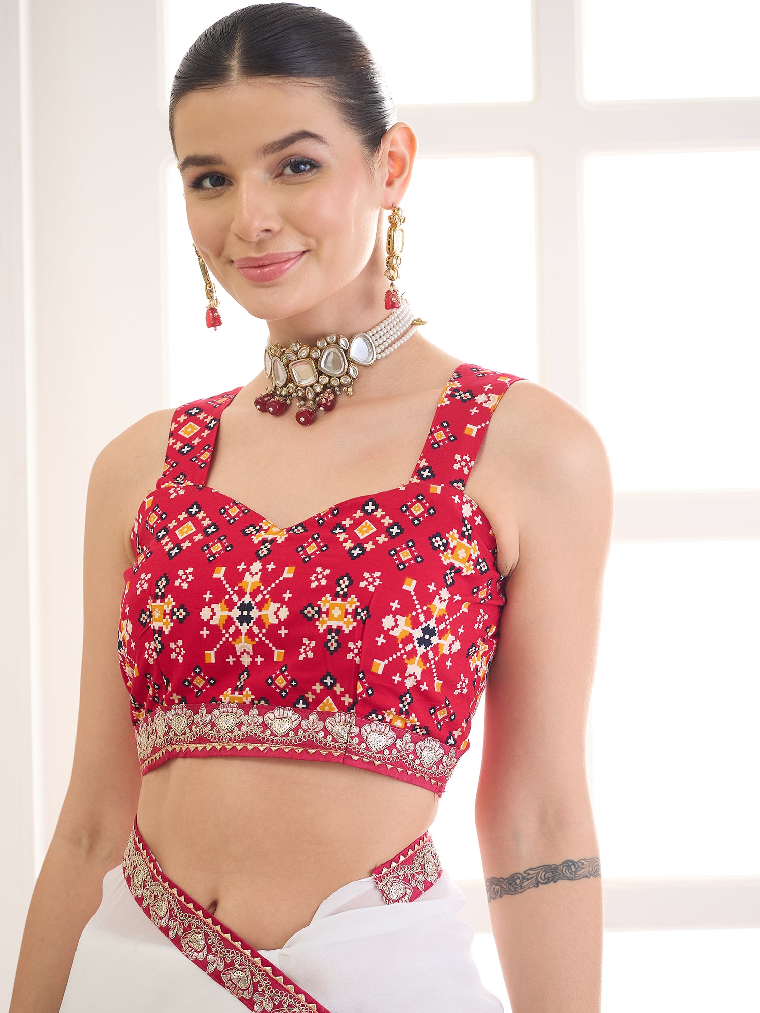 Unstitched red rayon blouse piece with embellished design