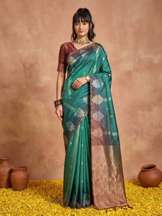 Woman wearing teal green cotton blend saree with ornamented surface design and brown blouse