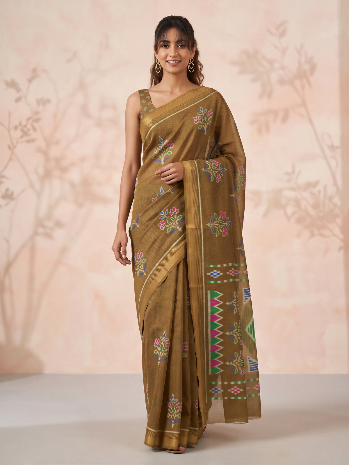 Woman wearing olive cotton linen saree with traditional indian motif work and olive blouse