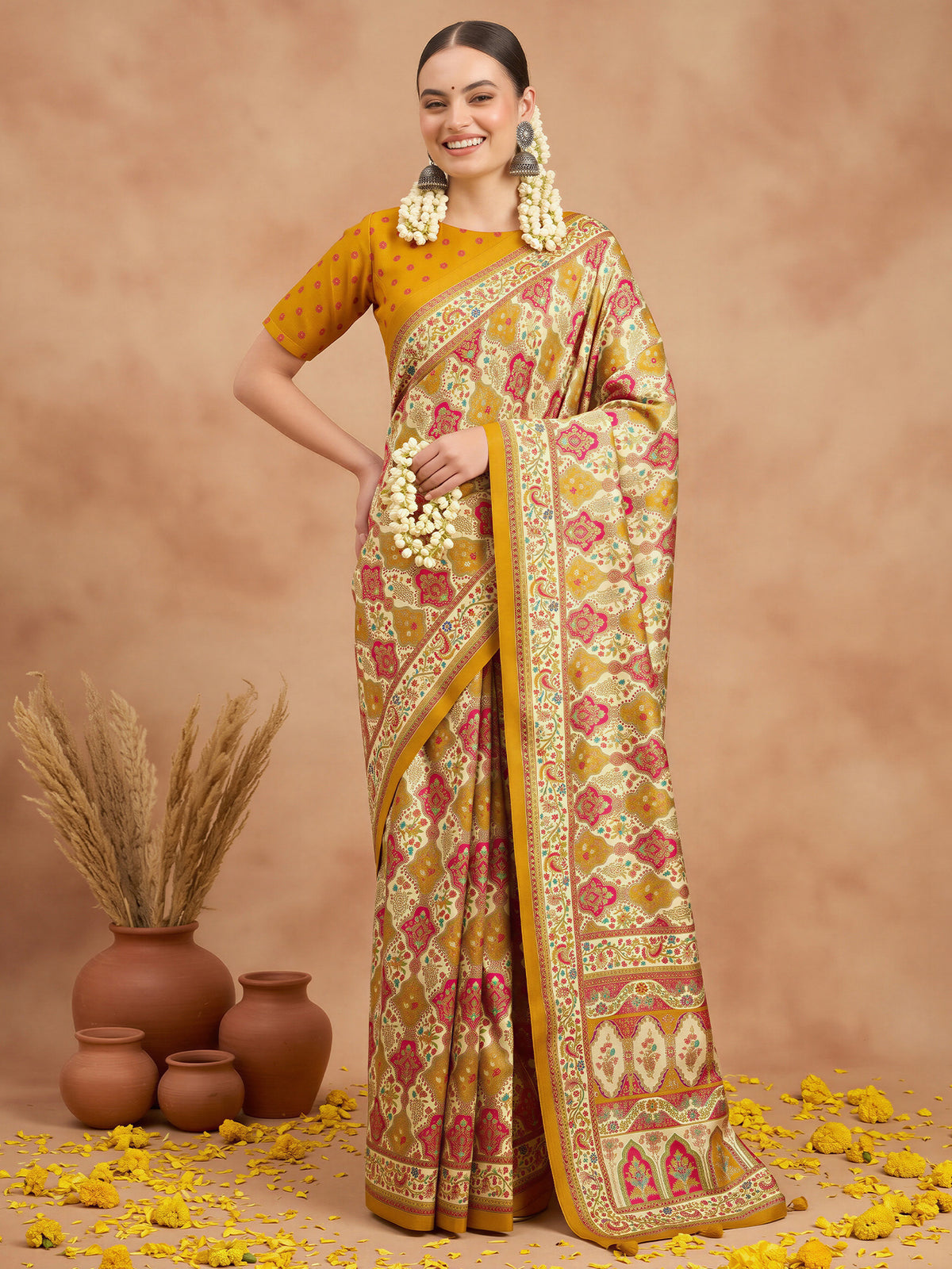Woman wearing cream silk blend saree with metallic foil print work and mustard blouse