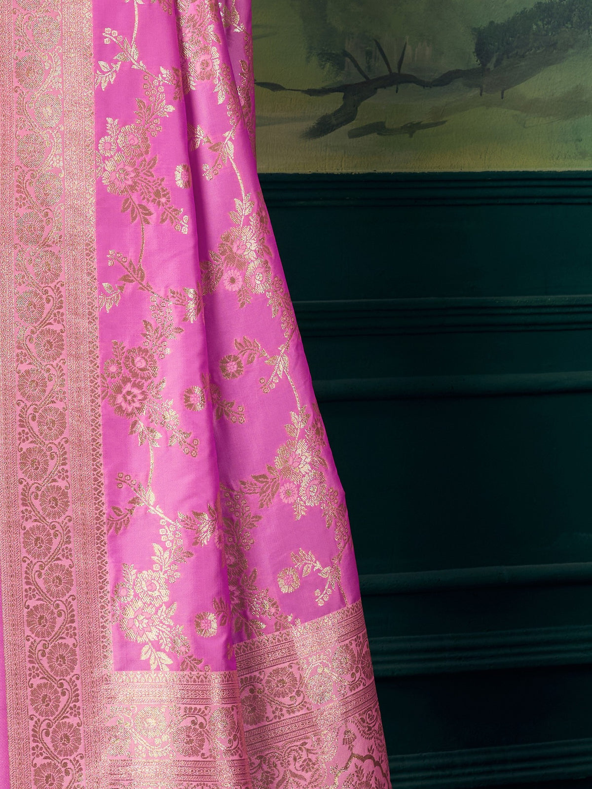 Pallu detail of pink banarasi silk saree showing woven motif design and zari border