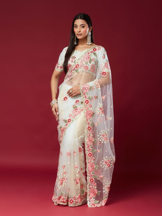 Woman wearing white net saree with embroidered motif work and white blouse