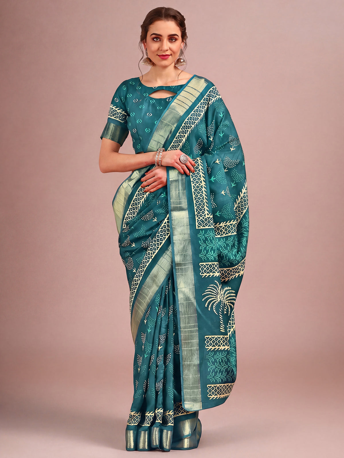 Woman wearing teal blue cotton silk saree with traditional indian motif work and teal blue blouse