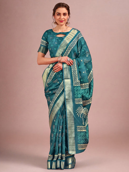 Woman wearing teal blue cotton silk saree with traditional indian motif work and teal blue blouse