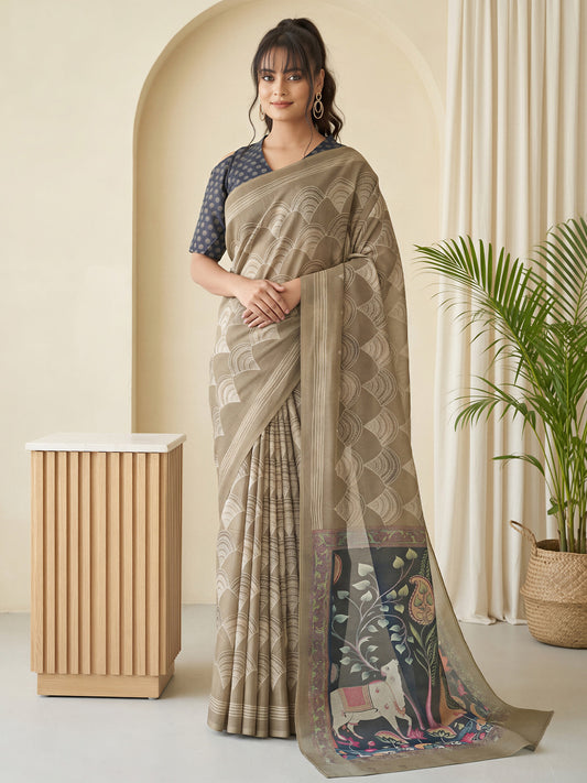Woman wearing beige linen blend saree with traditional indian motif work and black blouse