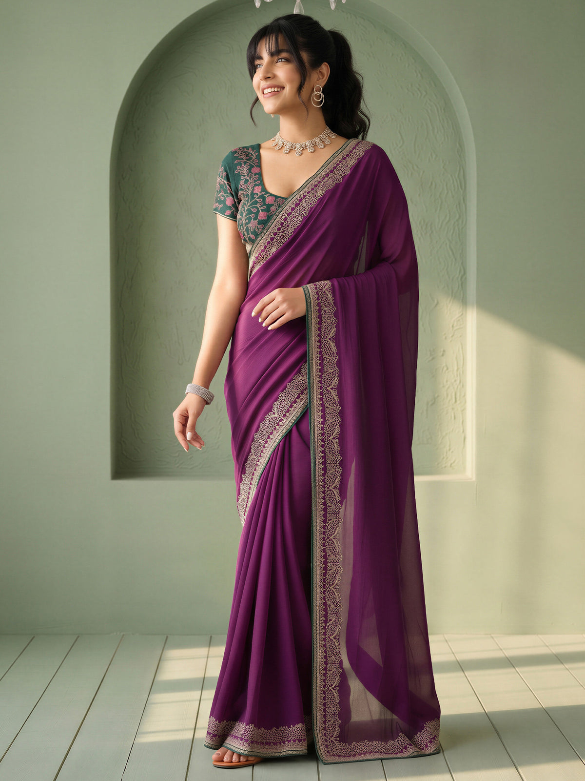 Woman wearing purple vichitra silk saree with clean solid-tone finish and green blouse