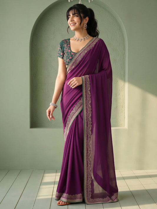 Woman wearing purple vichitra silk saree with clean solid-tone finish and green blouse