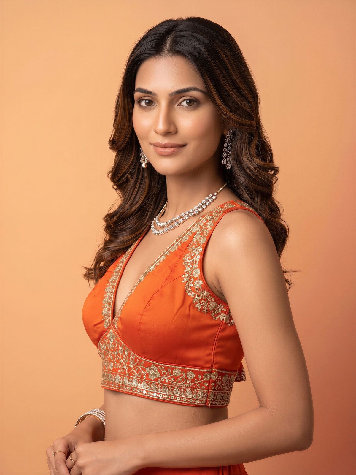 Orange sequin embellished silk blend sleeveless readymade saree blouse with deep v neck view 2