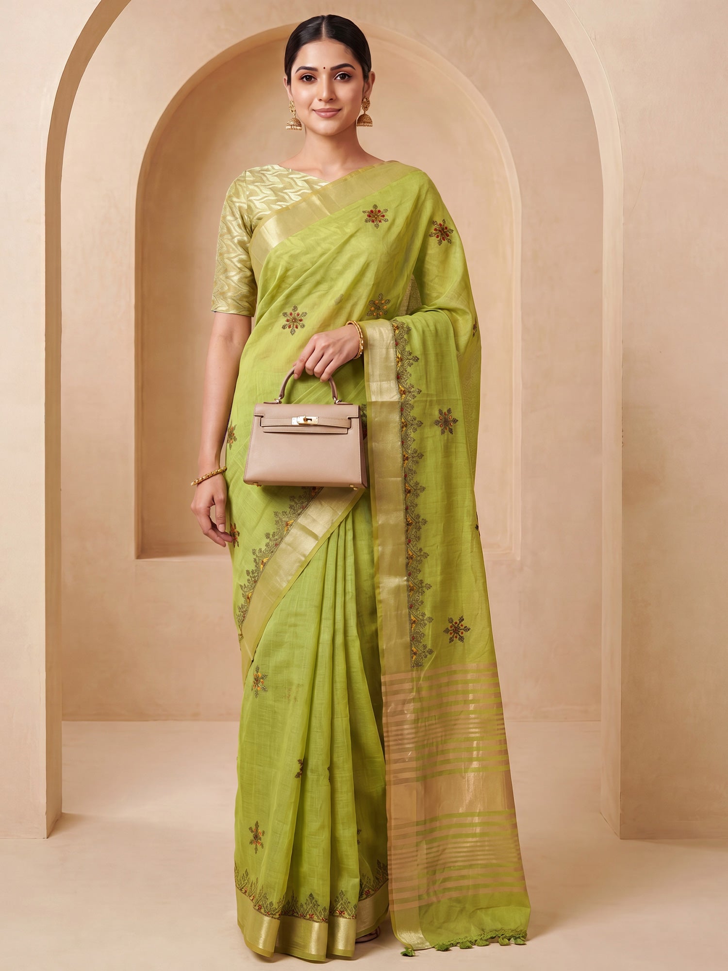 Woman wearing lime green cotton linen saree with embroidered motif work and lime green blouse