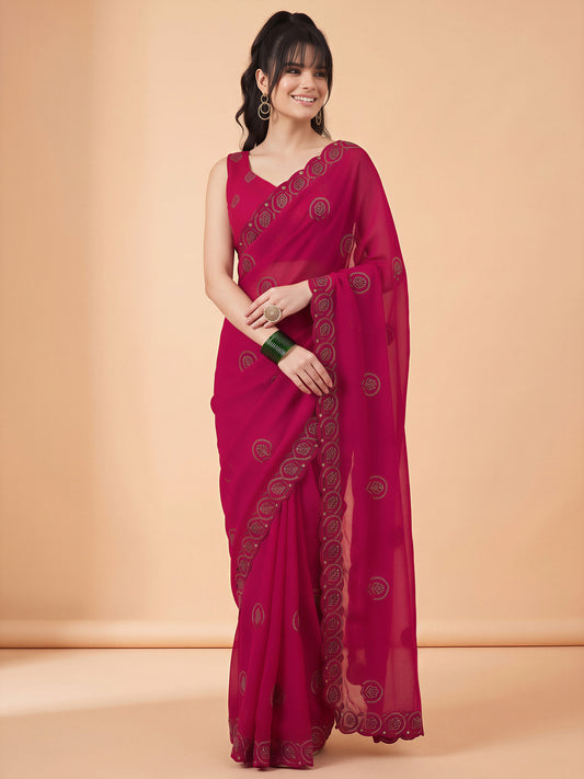Woman wearing pink tissue saree with ornamented surface design and pink blouse