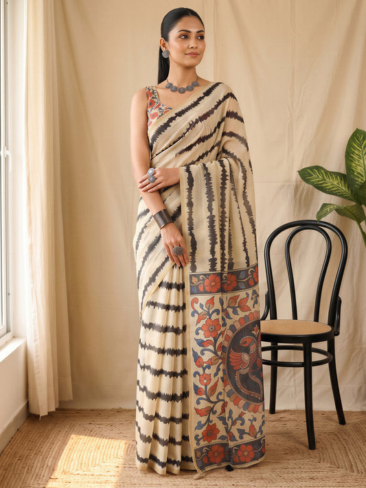 Woman wearing cream cotton blend saree with kalamkari narrative motif work and multicolored blouse