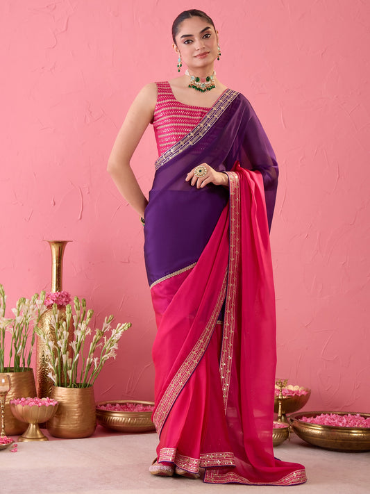 Woman wearing pink pure georgette ready to wear saree with ornamented surface design and pink blouse