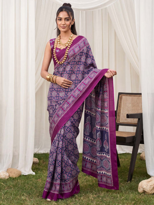 Woman wearing wine crepe saree with ajrak block-print motif work and wine blouse