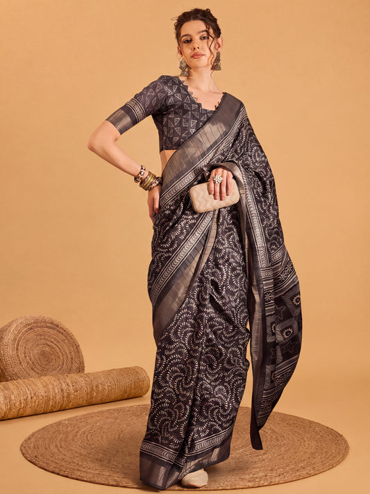 Woman wearing black silk blend saree with traditional indian motif work and black blouse