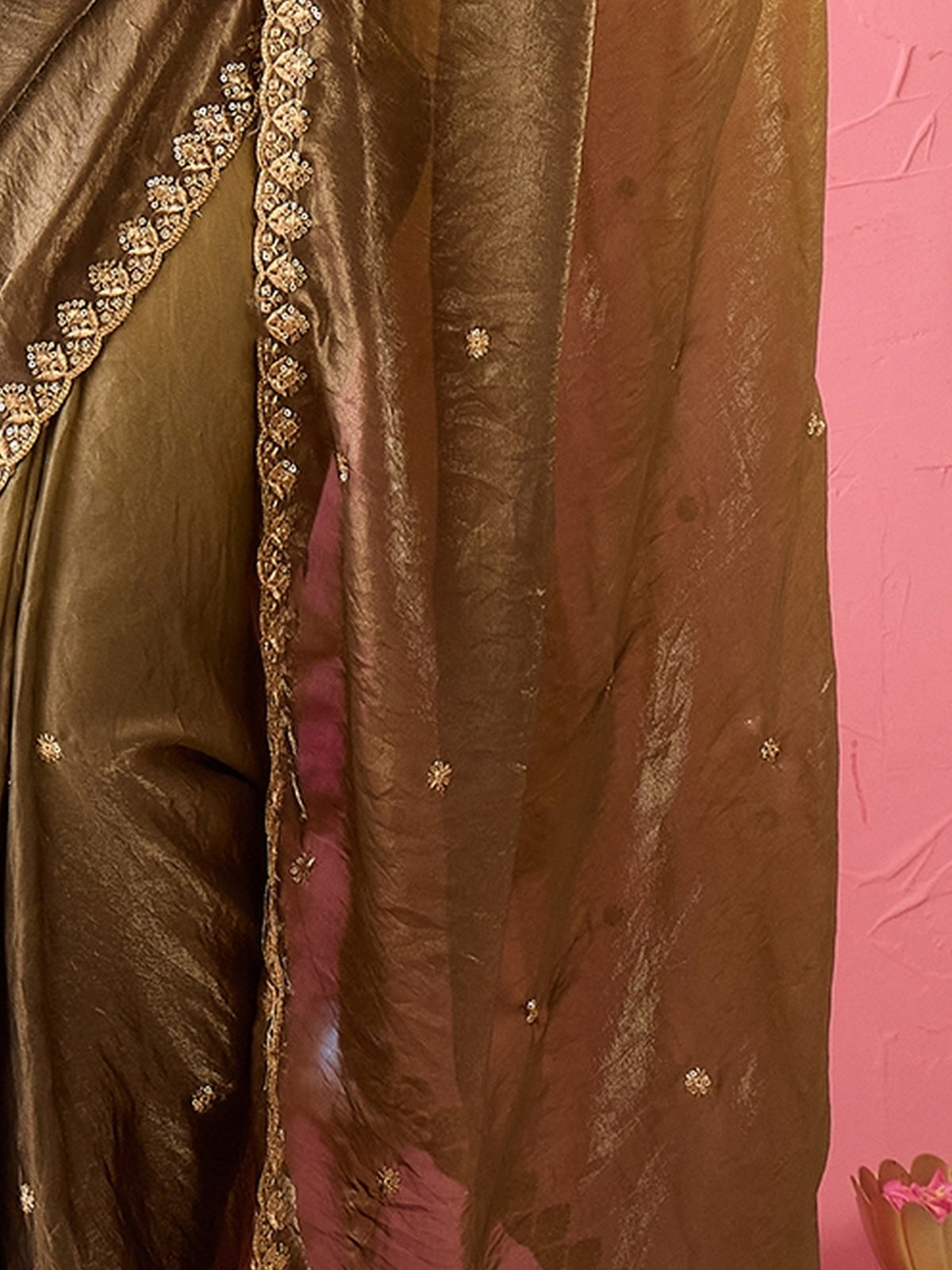 Pallu detail of olive paper silk saree showing embroidered motif work and embroidered border