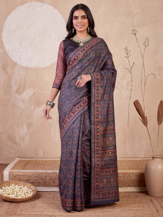 Woman wearing blue silk blend saree with ajrak block-print motif work and navy blue blouse