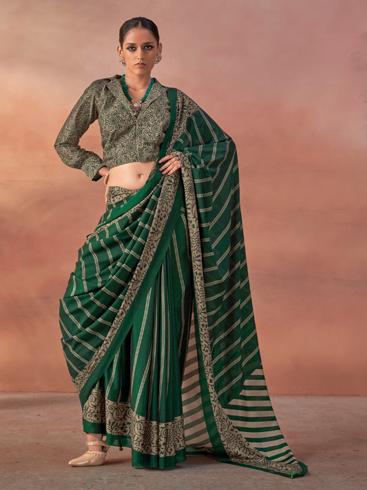 Woman wearing green silk blend saree with traditional indian motif work and green blouse