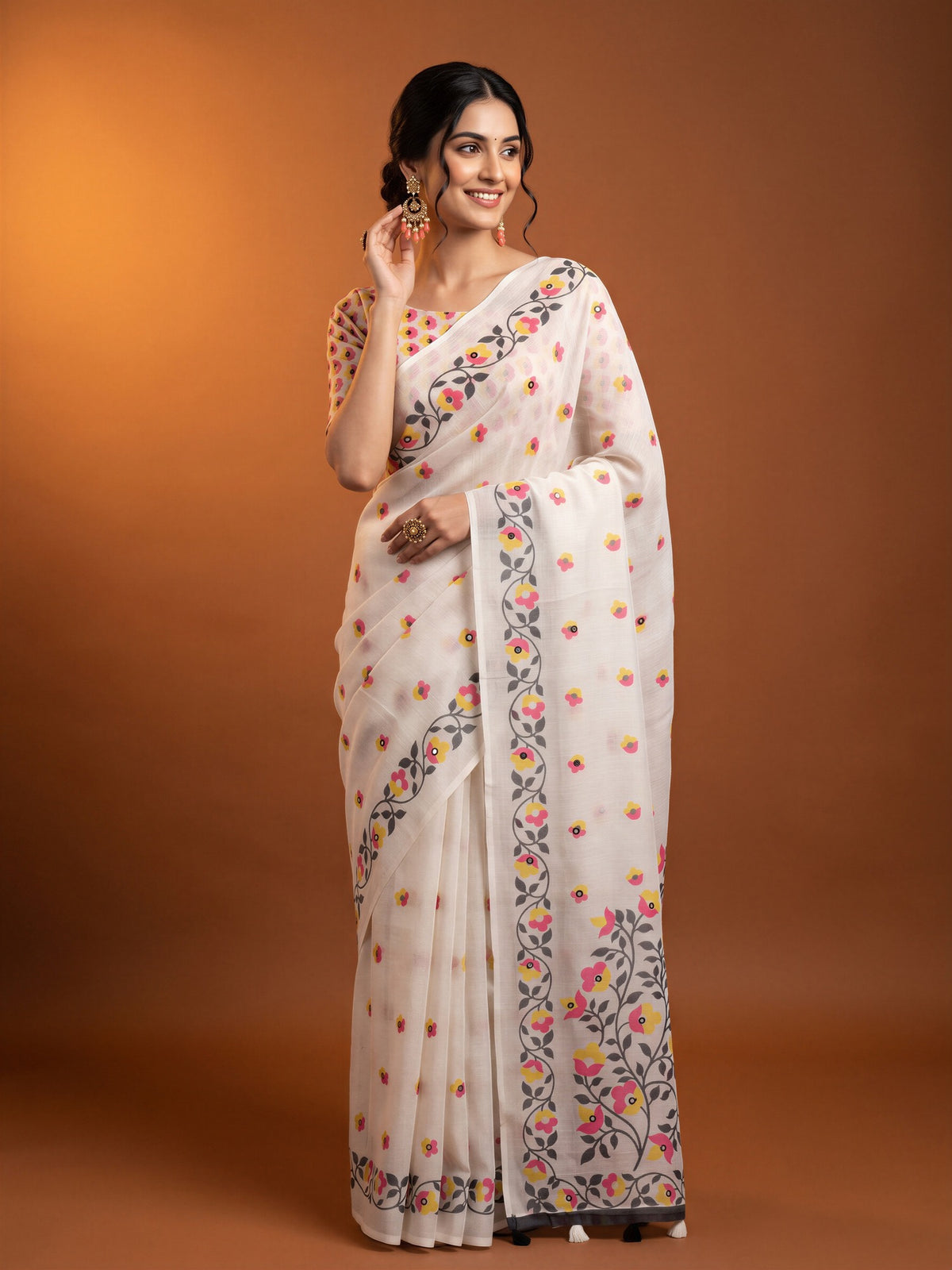 Woman wearing off white linen blend saree with all-over floral design and off white blouse